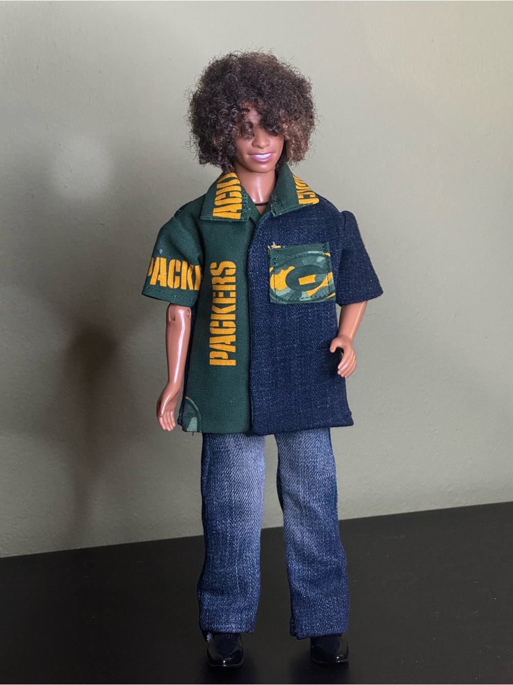 Handcrafted Green Bay Packers themed doll shirt with dark blue denim